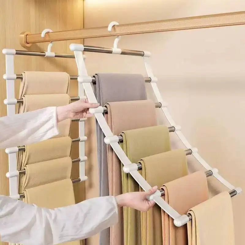 Multi-layer space-saving pants hanger holding multiple pairs of trousers in a closet