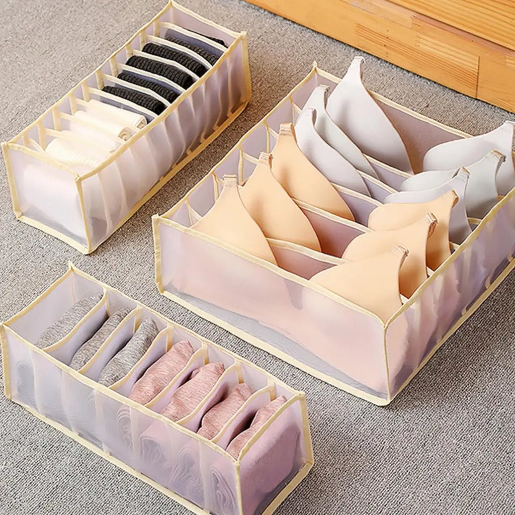 Drawer divider organizer grid compartments holding folded clothing