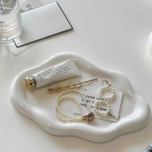 Cloud-shaped jewelry tray shown in silver and white color options