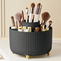 Rotating makeup organizer shown in pink, black, white, and cream