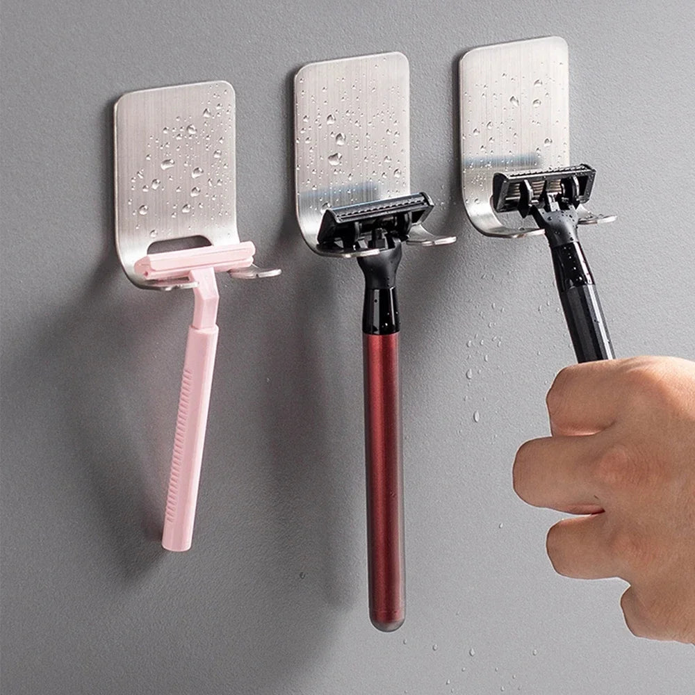 Stainless steel self-adhesive razor holder mounted on a shower wall