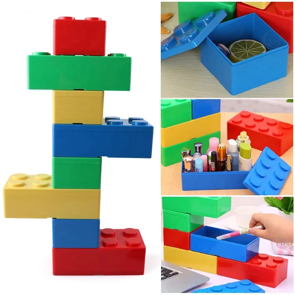 Stackable modular storage boxes in red, yellow, and green stacked on a desk